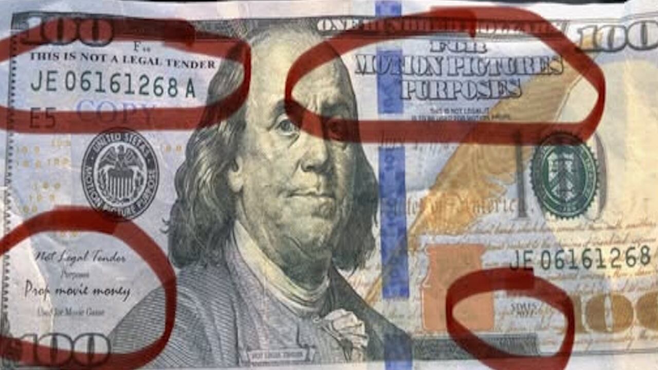 The bills are marked as movie prop bills.