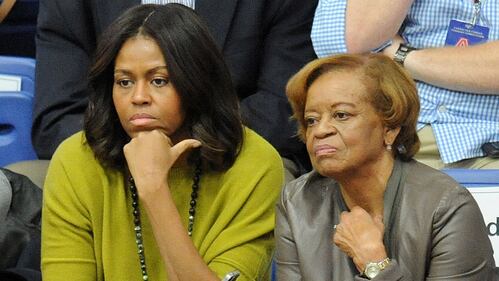 WASHINGTON, DC - NOVEMBER 23:  First lady Michelle Obama (L) and Marian Robinson watch a women's college basketball game between the Princeton Tigers and the American University Eagles at Bender Arena on November 23, 2014 in Washington, DC.  President Barack Obama's niece, Leslie Robinson, was playing for Princeton. (Photo by Mitchell Layton/Getty Images)