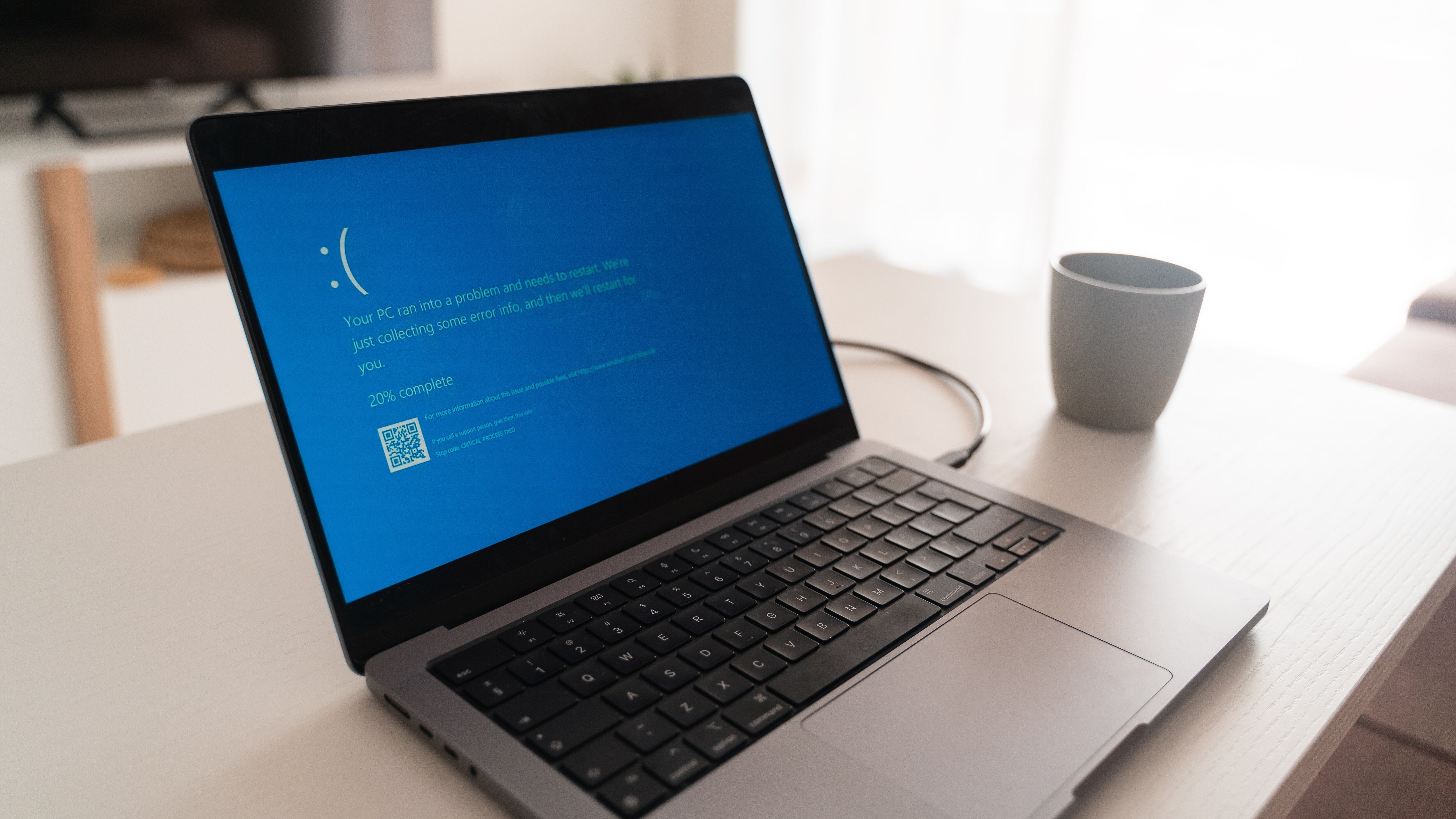 IT outage hits worldwide media, blue screen of death on the laptop